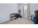 Bright bedroom with a small desk, ample light and ample space at 608 W Godwin St, Dunn, NC 28334