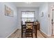 Cozy dining room with seating for four, natural light, and wood-look flooring creating a comfortable space at 608 W Godwin St, Dunn, NC 28334