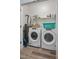 Bright laundry room with modern washer and dryer, and plenty of storage space at 608 W Godwin St, Dunn, NC 28334