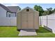 Backyard features an outdoor shed with wood paneling, complemented by a surrounding manicured lawn at 608 W Godwin St, Dunn, NC 28334