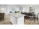 Open-concept layout showcases a spacious living room and modern kitchen at 6640 Gibraltar Rock Dr # 1073, Raleigh, NC 27610