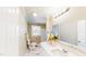 Modern bathroom with marble floors, a double vanity, and a well-lit mirror above the sink at 6715 Princeton Kenly Rd, Princeton, NC 27569