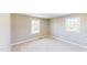 Bedroom with two windows and carpet at 6715 Princeton Kenly Rd, Princeton, NC 27569