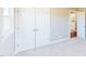 Bedroom with large closet, carpet, and a window at 6715 Princeton Kenly Rd, Princeton, NC 27569