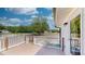 Inviting wood deck with white railing, offering serene outdoor views, adds charm to the property at 6715 Princeton Kenly Rd, Princeton, NC 27569
