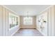 Dining room with natural light, neutral walls, and built-in shelving at 6715 Princeton Kenly Rd, Princeton, NC 27569