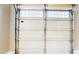 White garage door with windows and metal framing at 6715 Princeton Kenly Rd, Princeton, NC 27569