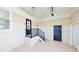 Clean garage with concrete flooring, a window and staircase at 6715 Princeton Kenly Rd, Princeton, NC 27569
