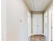 Hallway featuring hardwood floors, neutral walls and double doors that lead to bedrooms at 6715 Princeton Kenly Rd, Princeton, NC 27569