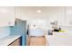 Modern kitchen featuring white cabinets, stainless steel appliances, and beautiful quartz countertops for a sleek and stylish look at 6715 Princeton Kenly Rd, Princeton, NC 27569