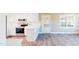 Open kitchen features an island with storage, stainless steel appliances, and modern finishes at 6715 Princeton Kenly Rd, Princeton, NC 27569