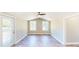 This spacious living room boasts neutral walls, natural light, and sleek flooring that creates a warm and inviting atmosphere at 6715 Princeton Kenly Rd, Princeton, NC 27569