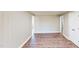 Open living area with neutral walls, multiple entries, and vinyl plank floors at 6715 Princeton Kenly Rd, Princeton, NC 27569