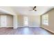 Inviting living room with a ceiling fan, natural light, and sleek flooring, offers a blend of comfort and style at 6715 Princeton Kenly Rd, Princeton, NC 27569