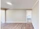 Bright living room with neutral walls and vinyl plank flooring at 6715 Princeton Kenly Rd, Princeton, NC 27569