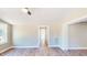 Bright living room featuring new, light-colored flooring and neutral walls, creating a serene and inviting space at 6715 Princeton Kenly Rd, Princeton, NC 27569