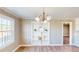 Living room with large window, built-in shelving, and neutral walls at 6715 Princeton Kenly Rd, Princeton, NC 27569