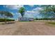 Back of house featuring a large bare yard with partial fencing at 6715 Princeton Kenly Rd, Princeton, NC 27569