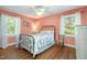 Charming bedroom featuring hardwood floors, bright natural light and decorative accents at 708 W Main St, Carrboro, NC 27510