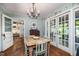 Dining room with decorative walls, hardwood floors, and access to outdoor patio at 708 W Main St, Carrboro, NC 27510