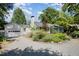 Charming home with lush landscaping, a well-maintained front yard, and a detached garage at 708 W Main St, Carrboro, NC 27510