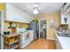 Functional kitchen with white appliances, ample cabinet space and adjacent dining area at 708 W Main St, Carrboro, NC 27510