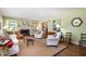 Spacious living room featuring a fireplace, hardwood floors and neutral decor at 708 W Main St, Carrboro, NC 27510