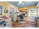 Cozy home office features built-in shelving, unique flooring, and ample natural light at 708 W Main St, Carrboro, NC 27510