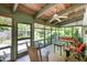 Inviting screened-in porch with comfortable seating and peaceful backyard views at 708 W Main St, Carrboro, NC 27510