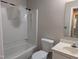Standard bathroom with shower and tub combination, white toilet and sink with vanity at 710 E Azalea Ct, Fuquay Varina, NC 27526
