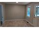 Cozy dining area with tiled floors, a window, and access to a back door at 710 E Azalea Ct, Fuquay Varina, NC 27526