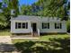 Charming one-story home with black shutters, gabled roof, and well-maintained yard at 710 E Azalea Ct, Fuquay Varina, NC 27526