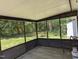 Relaxing screened porch with views of the backyard and a tranquil outdoor setting at 710 E Azalea Ct, Fuquay Varina, NC 27526