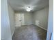 Neutral bedroom features ceiling fan and closet space at 717 Papsworth Ct, Fuquay Varina, NC 27526