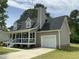 Attractive two-story home with a covered front porch and attached garage at 717 Papsworth Ct, Fuquay Varina, NC 27526