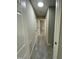 Carpeted hallway with access to multiple rooms at 717 Papsworth Ct, Fuquay Varina, NC 27526