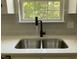 Kitchen sink has stainless steel basin with a gooseneck faucet at 717 Papsworth Ct, Fuquay Varina, NC 27526
