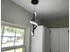 Modern spiral pendant light fixture adds a stylish touch to the kitchen area at 717 Papsworth Ct, Fuquay Varina, NC 27526