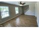 Inviting living room with wood-look floors and plenty of natural light at 717 Papsworth Ct, Fuquay Varina, NC 27526