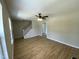 Spacious living room with stairs, wood-look floors, and neutral paint at 717 Papsworth Ct, Fuquay Varina, NC 27526