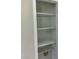 White shelves with available washer hookups at 717 Papsworth Ct, Fuquay Varina, NC 27526