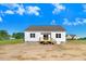 View of the home's rear exterior with a wooden deck, perfect for outdoor enjoyment at 72 Glenwood Pl, Kenly, NC 27542