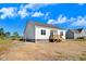 Back exterior featuring a wooden deck, windows, and white siding, with a neighboring house visible at 72 Glenwood Pl, Kenly, NC 27542