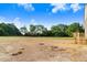 Beautiful new backyard with newly installed wooden stairs leading from a future deck at 72 Glenwood Pl, Kenly, NC 27542