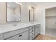 Modern bathroom with double vanity, large mirrors, and a shower-tub combination at 72 Glenwood Pl, Kenly, NC 27542