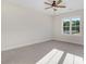 A bright, spacious bedroom with neutral carpet and a ceiling fan, offers a relaxing retreat at 72 Glenwood Pl, Kenly, NC 27542