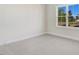 Bright bedroom featuring plush carpeting and a large window with a view at 72 Glenwood Pl, Kenly, NC 27542