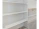 Spacious walk-in closet with built-in shelving for optimal organization and storage at 72 Glenwood Pl, Kenly, NC 27542