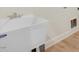 Practical laundry room area with a utility sink and convenient plumbing connections at 72 Glenwood Pl, Kenly, NC 27542