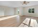 Open-concept living room featuring modern flooring, great light, and access to a back patio at 72 Glenwood Pl, Kenly, NC 27542